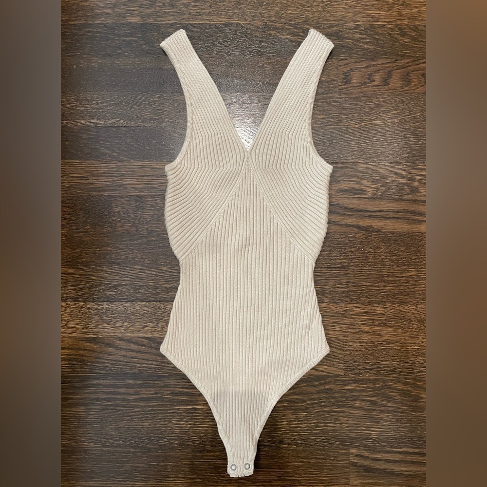 Cream, ribbed body suit. Never worn.